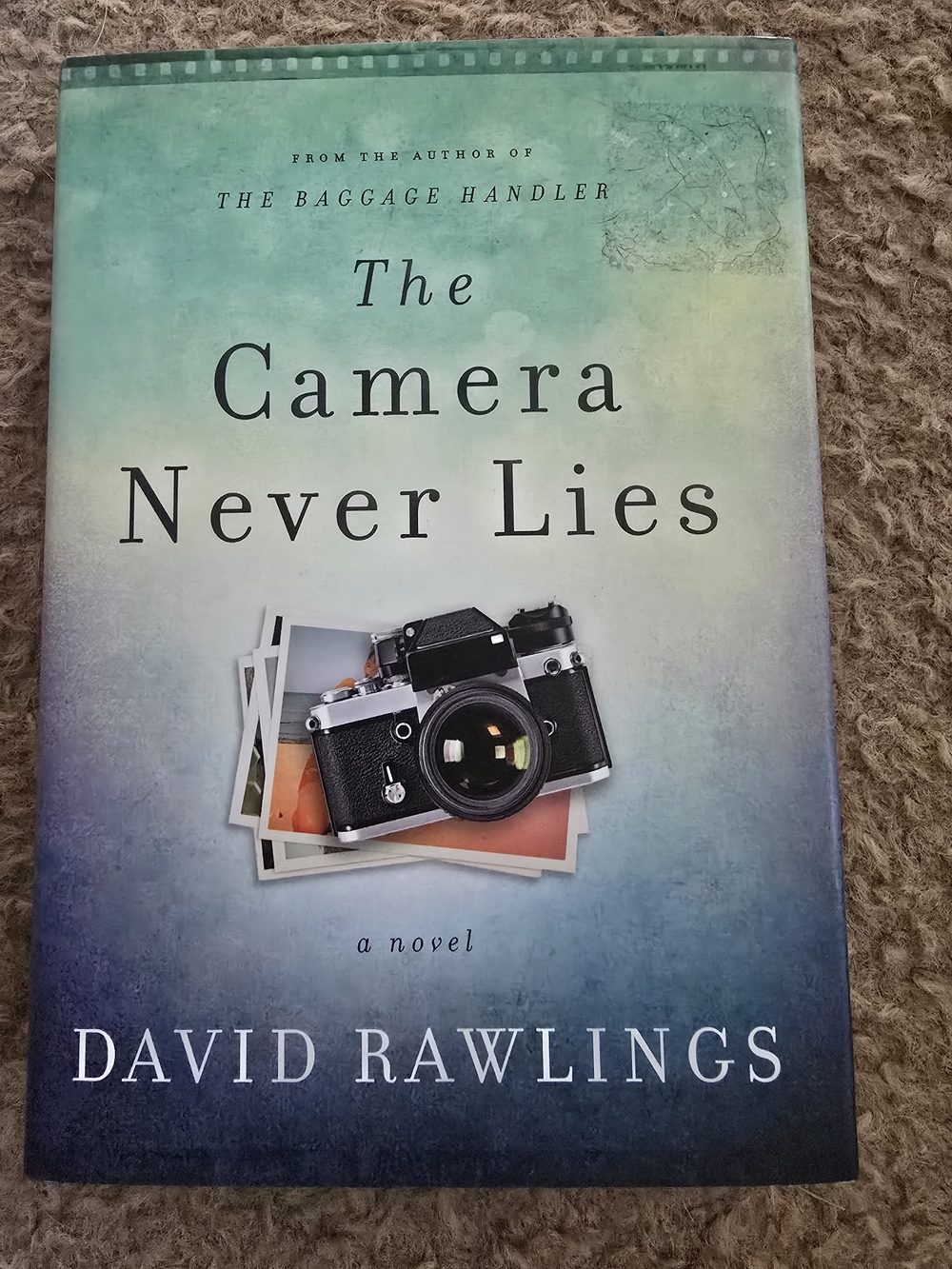 4/$15 The Camera Never Lies by David Rawlings - Teal to Blue Hardcover